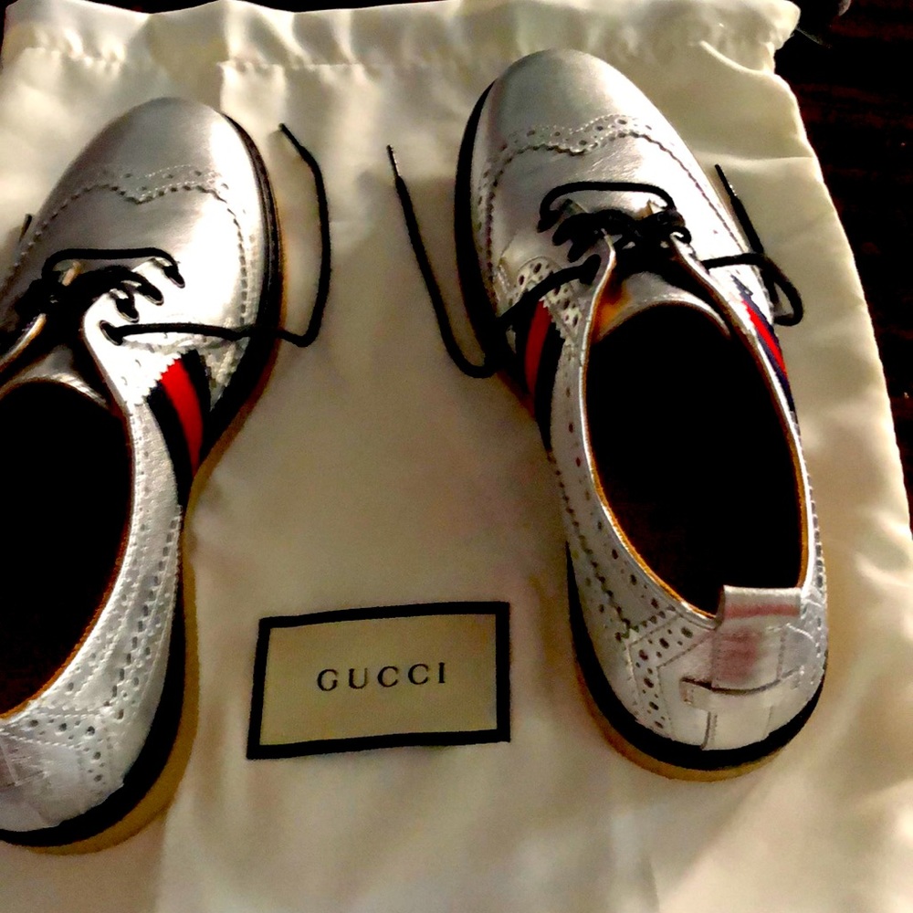 Kids size 33 Gucci silver oxfords. New with dust bag. Never worn.